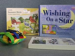 Items from one of the Dementia MYLE Kits available for checkout from Outreach Services