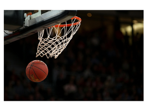 A basketball is pictured in mid-air after flying through the hoop and net.