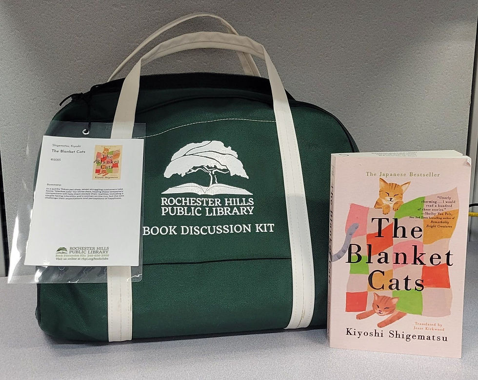 An image of an RHPL book kit and book. A green bag with the RHPL logo and a card describing the contents. The book displayed is called The Blanket cats