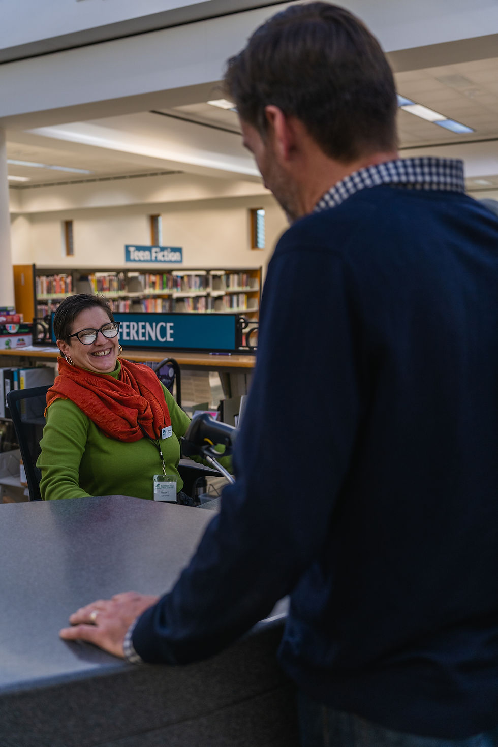 A patron gets assistance from an RHPL librarian