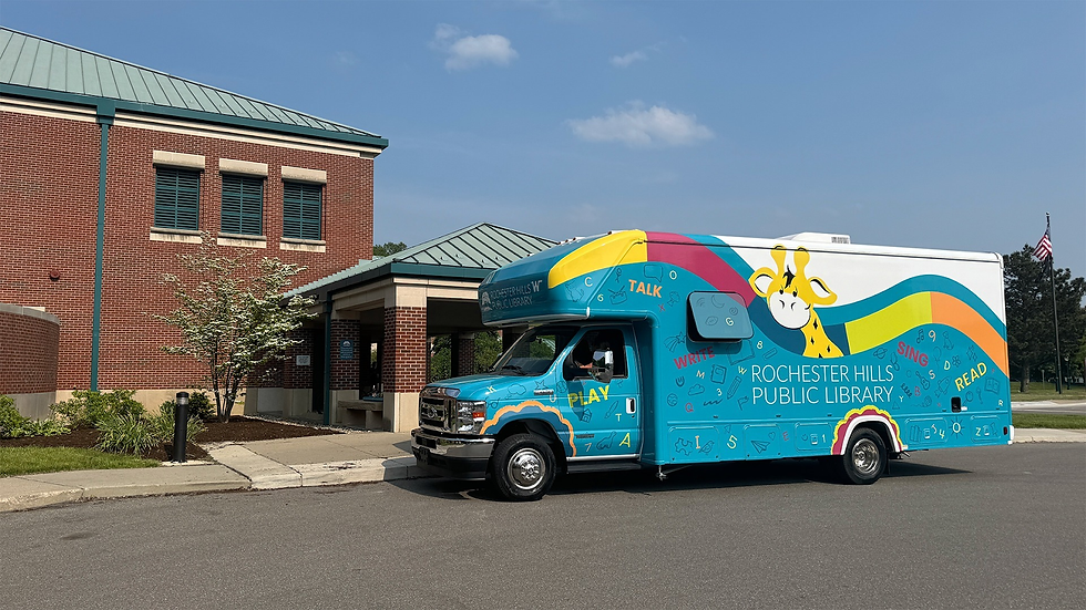 The RHPL Early Literacy bus parked outside the library.